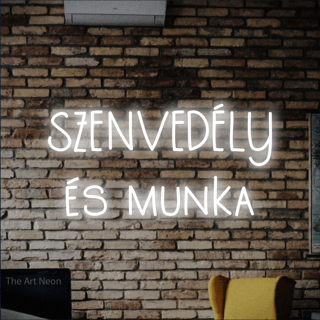 LED neon sign reading “SZENVEDÉLY és munka”, arranged in two lines.