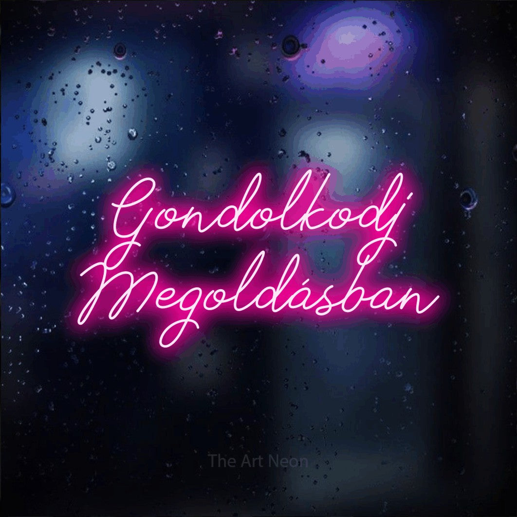 LED neon sign reading “Gondolkodj Megoldásban”, arranged in two lines.