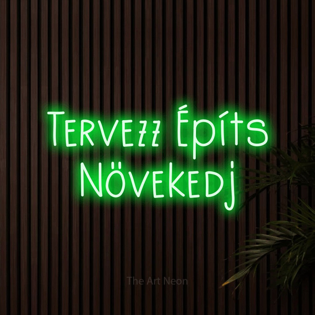 LED neon sign reading “Tervezz Építs Növekedj”, arranged in two lines.