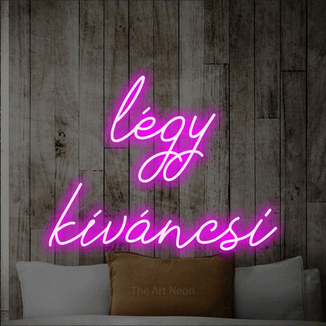 LED neon sign reading “légy kíváncsi”, arranged in two lines.
