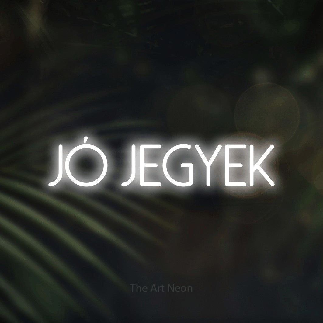 LED neon sign reading “JÓ JEGYEK”, arranged in a single line.