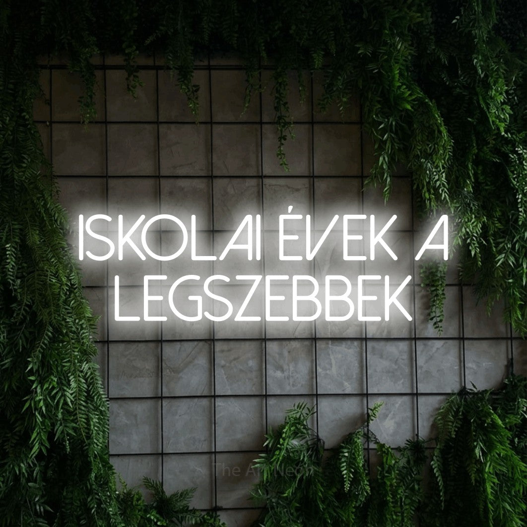 LED neon sign reading “iskolai évek a legszebbek”, arranged in two lines.