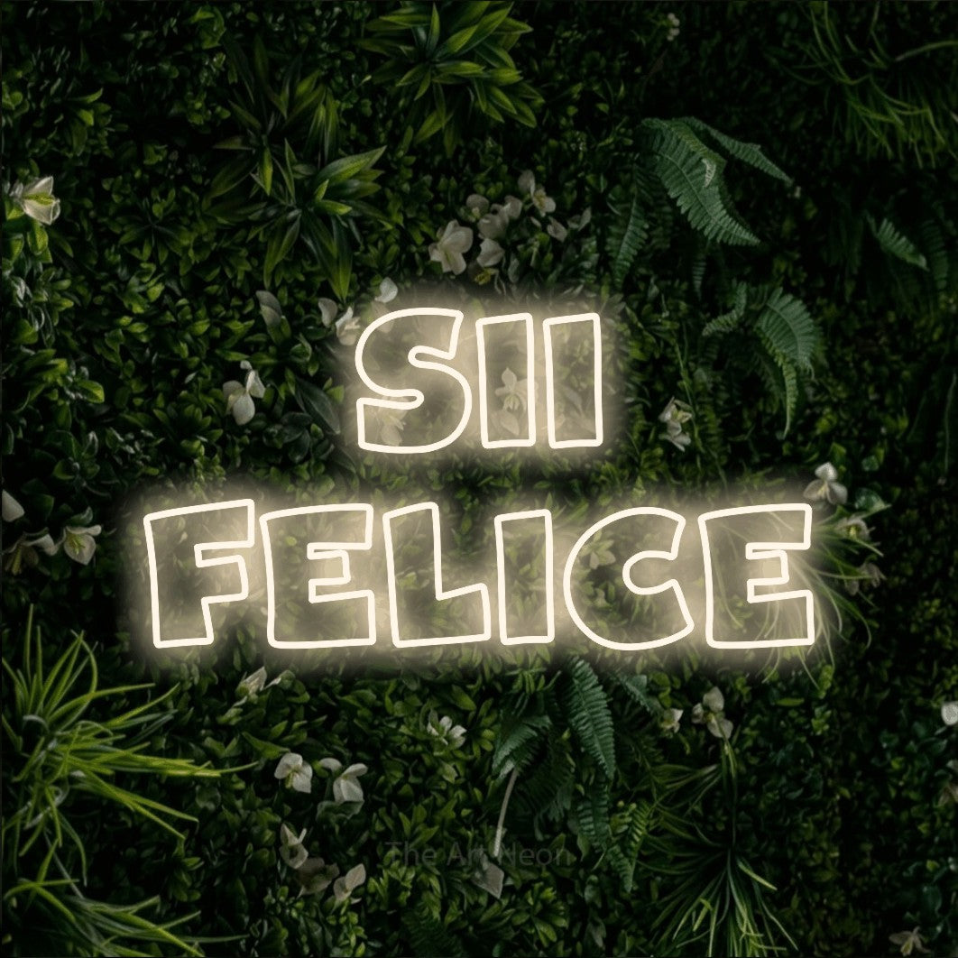 LED neon sign reading “Sii Felice”, arranged in 2 lines.