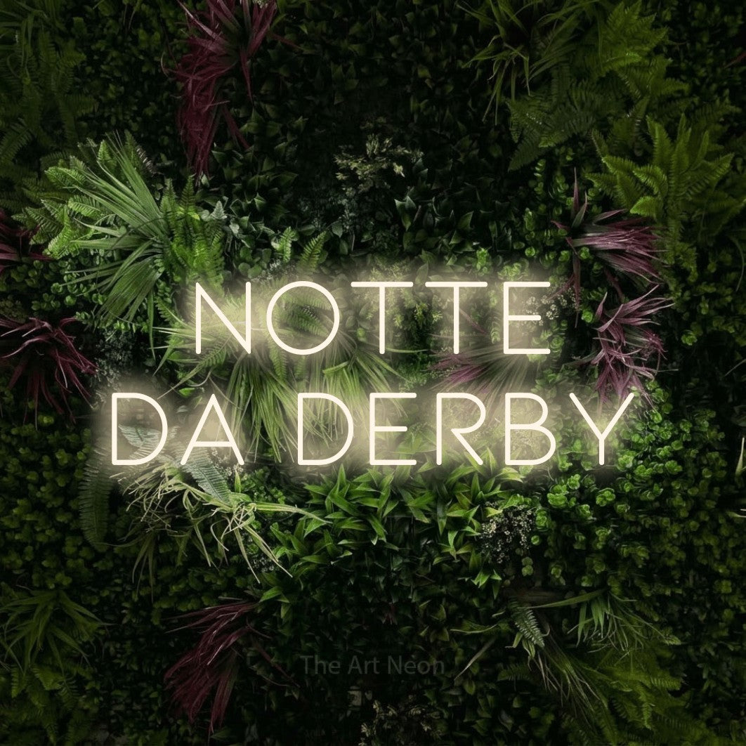 LED neon sign reading “notte da derby”, arranged in 2 lines.