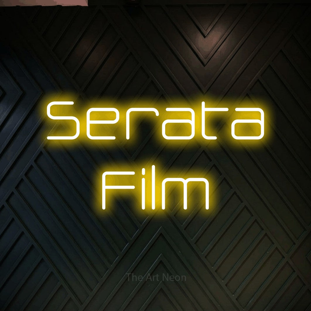 LED neon sign reading “Serata Film”, arranged in 2 lines.