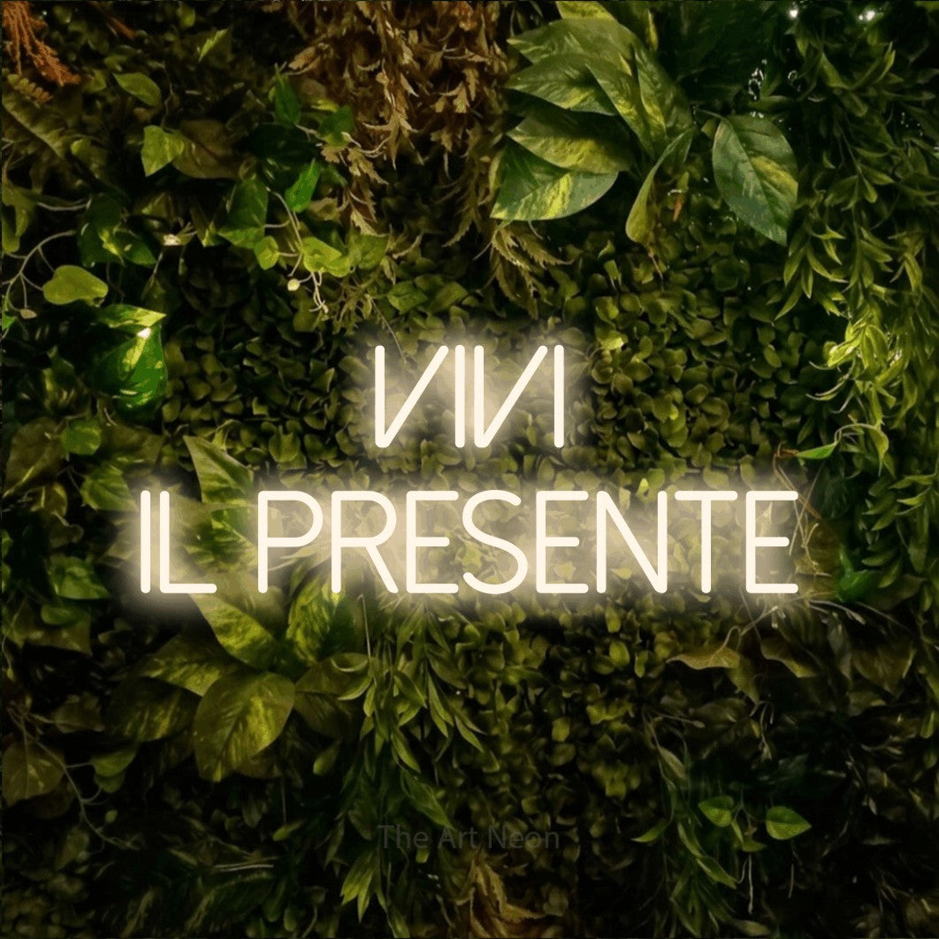 LED neon sign reading “Vivi il Presente”, arranged in 2 lines.