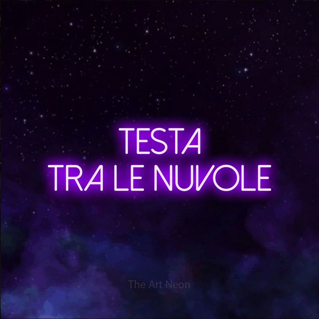 LED neon sign reading “testa tra le nuvole”, arranged in 2 lines.