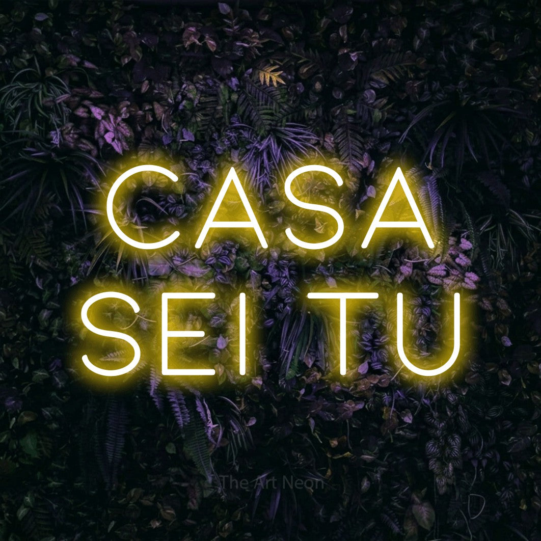 LED neon sign reading “casa sei tu”, arranged in 2 lines.