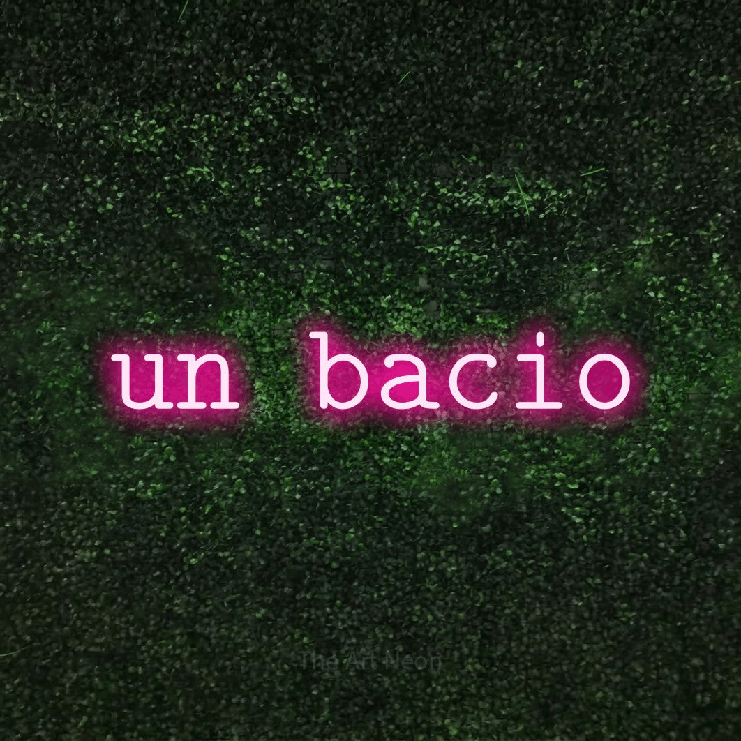 LED neon sign reading “un bacio”, arranged in a single line.