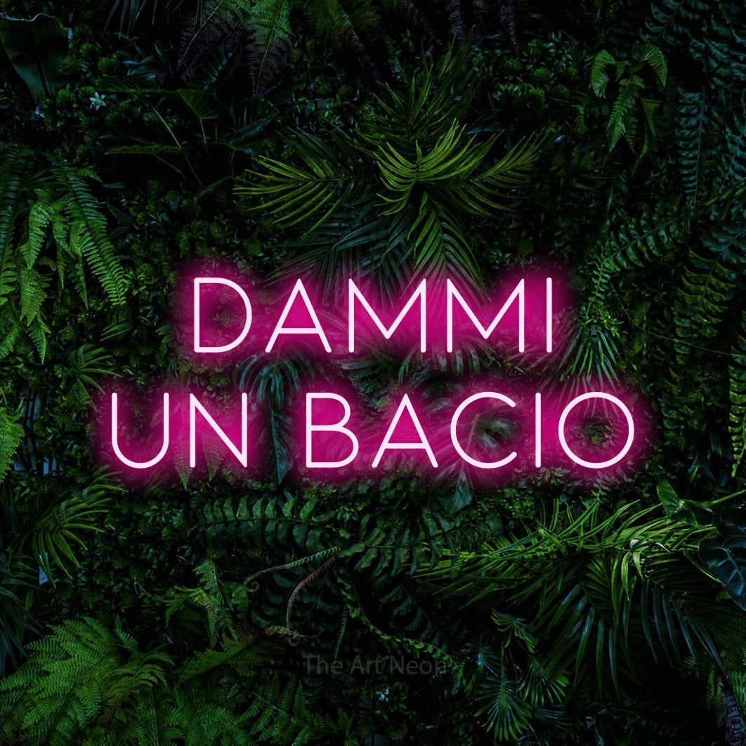 LED neon sign reading “DAMMI UN BACIO”, arranged in 2 lines.