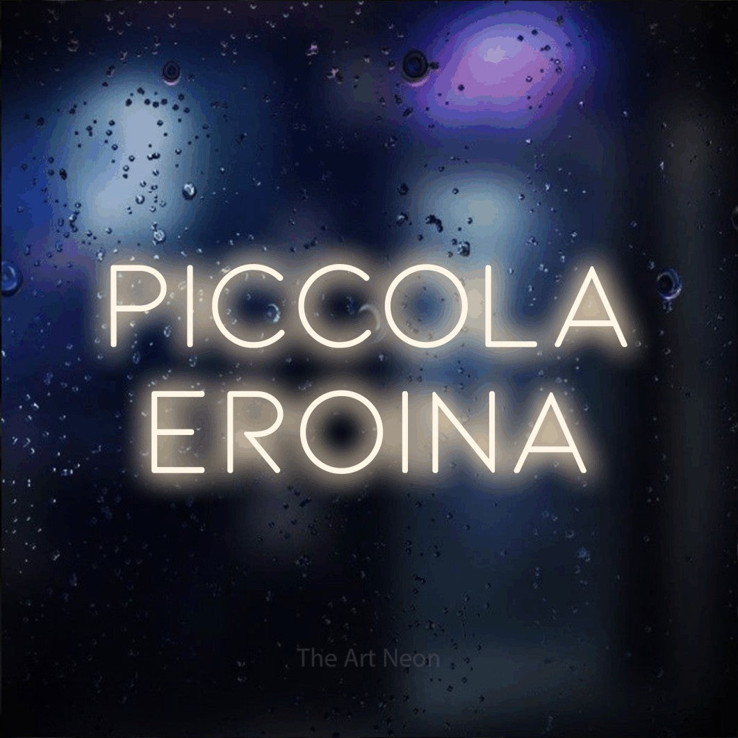 LED neon sign reading “PICCOLA EROINA”, arranged in 2 lines.