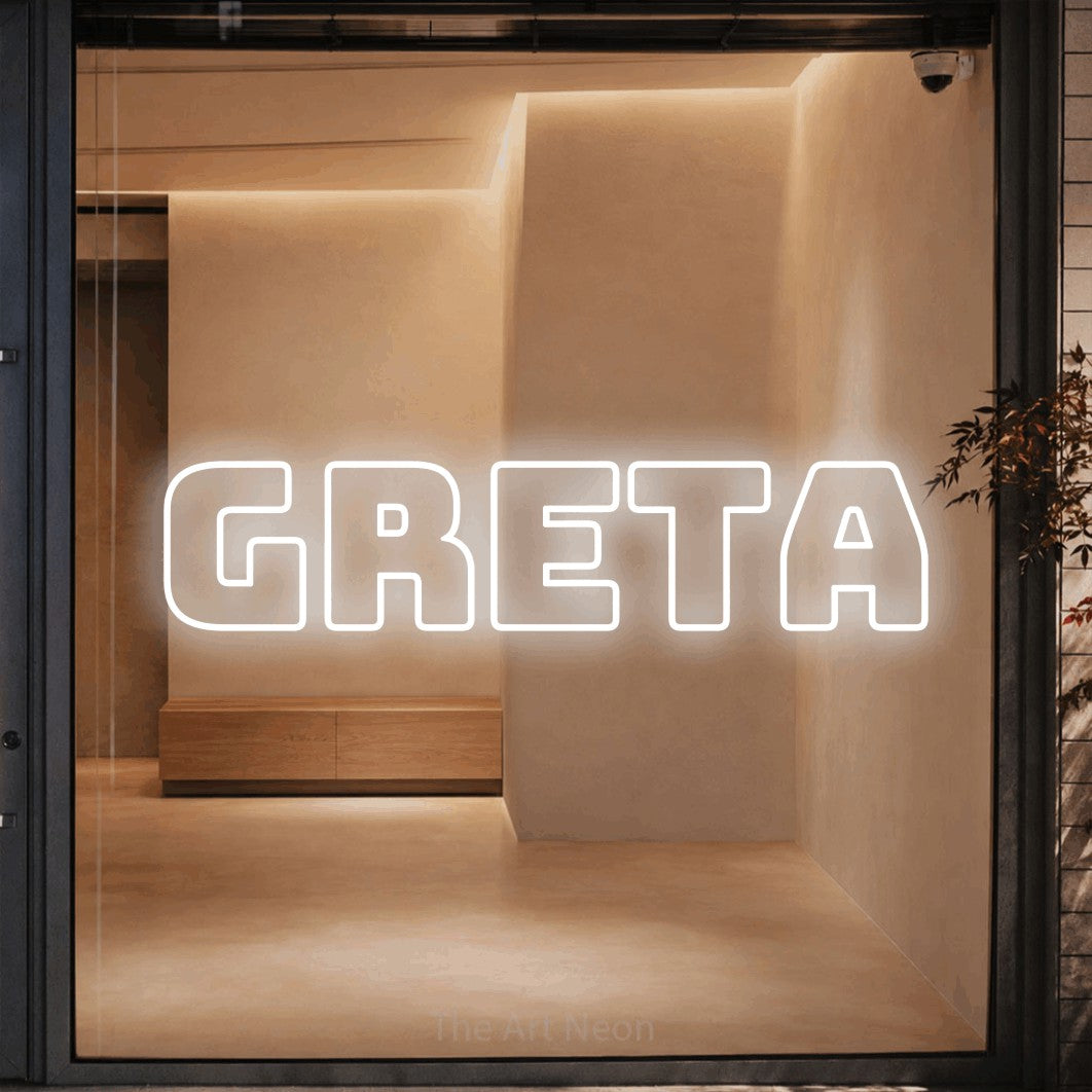LED neon sign reading “greta”, arranged in a single line.