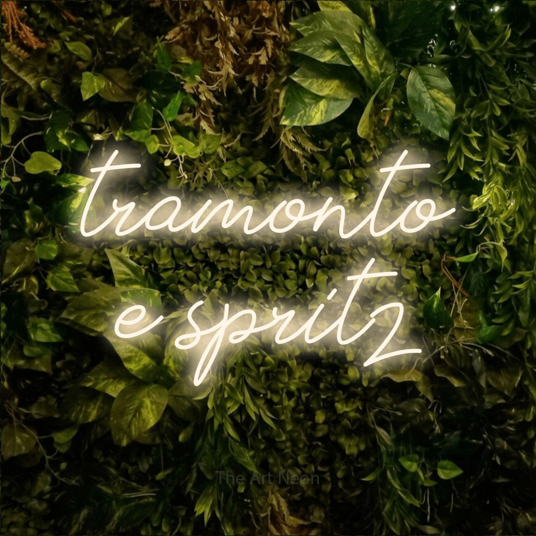 LED neon sign reading “tramonto e spritz”, arranged in 2 lines.