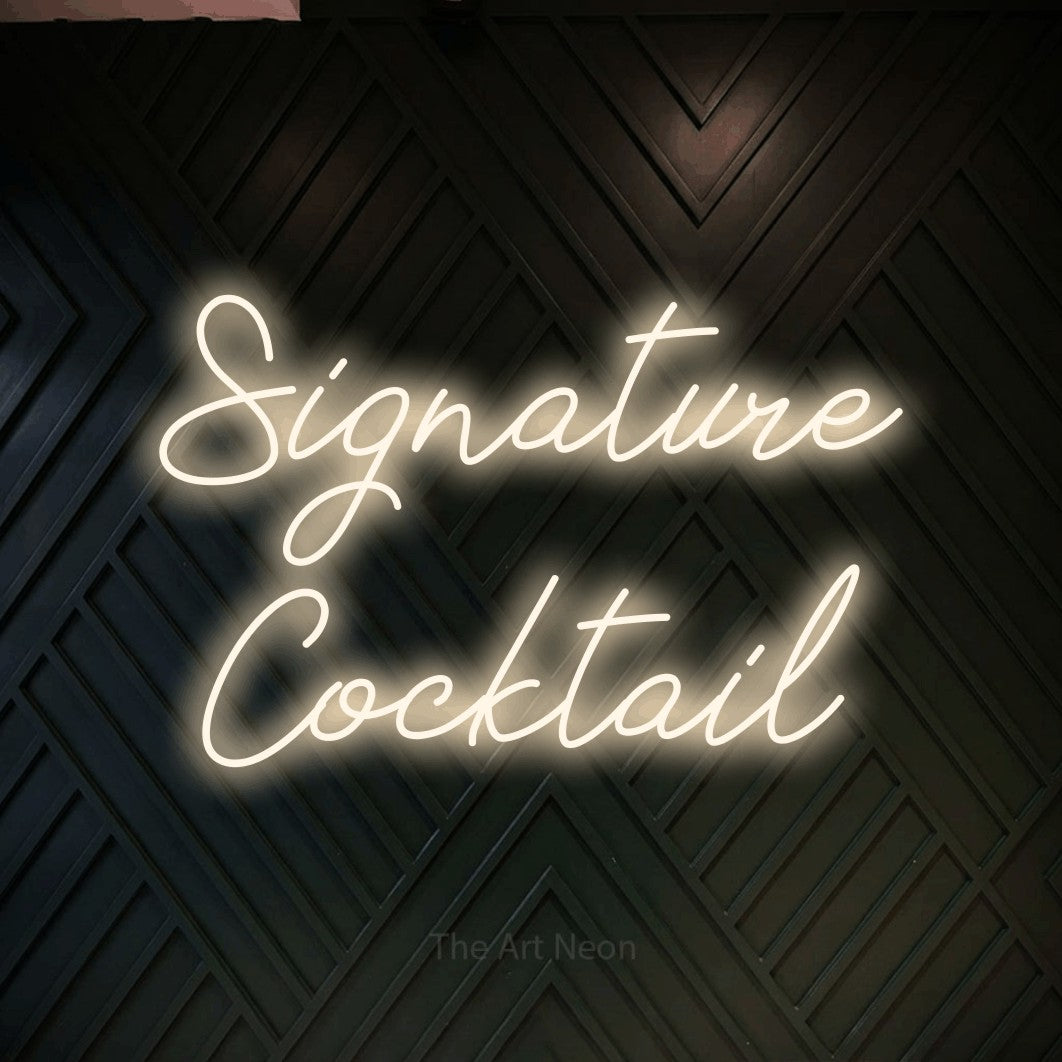 LED neon sign reading “Signature Cocktail”, arranged in 2 lines.