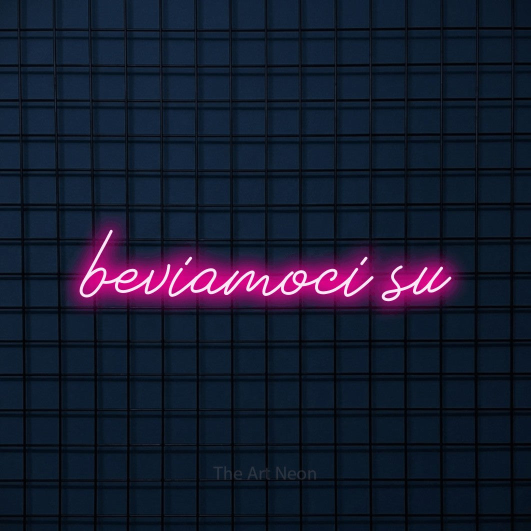 LED neon sign reading “beviamoci su”, arranged in a single line.