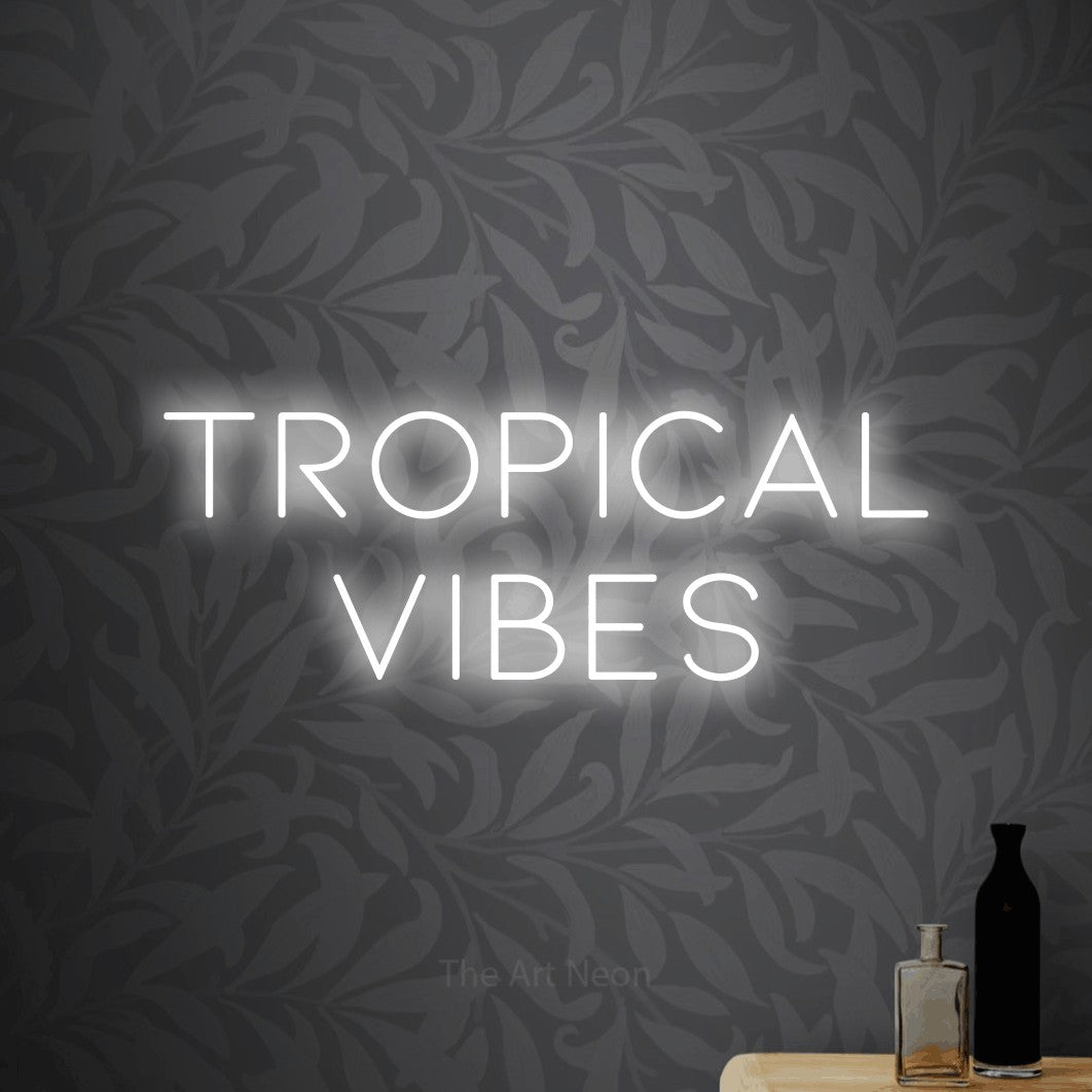 LED neon sign reading “TROPICAL VIBES”, arranged in 2 lines.