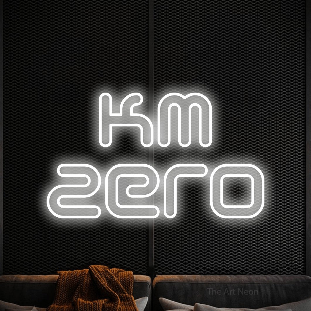 LED neon sign reading “km zero”, arranged in 2 lines.