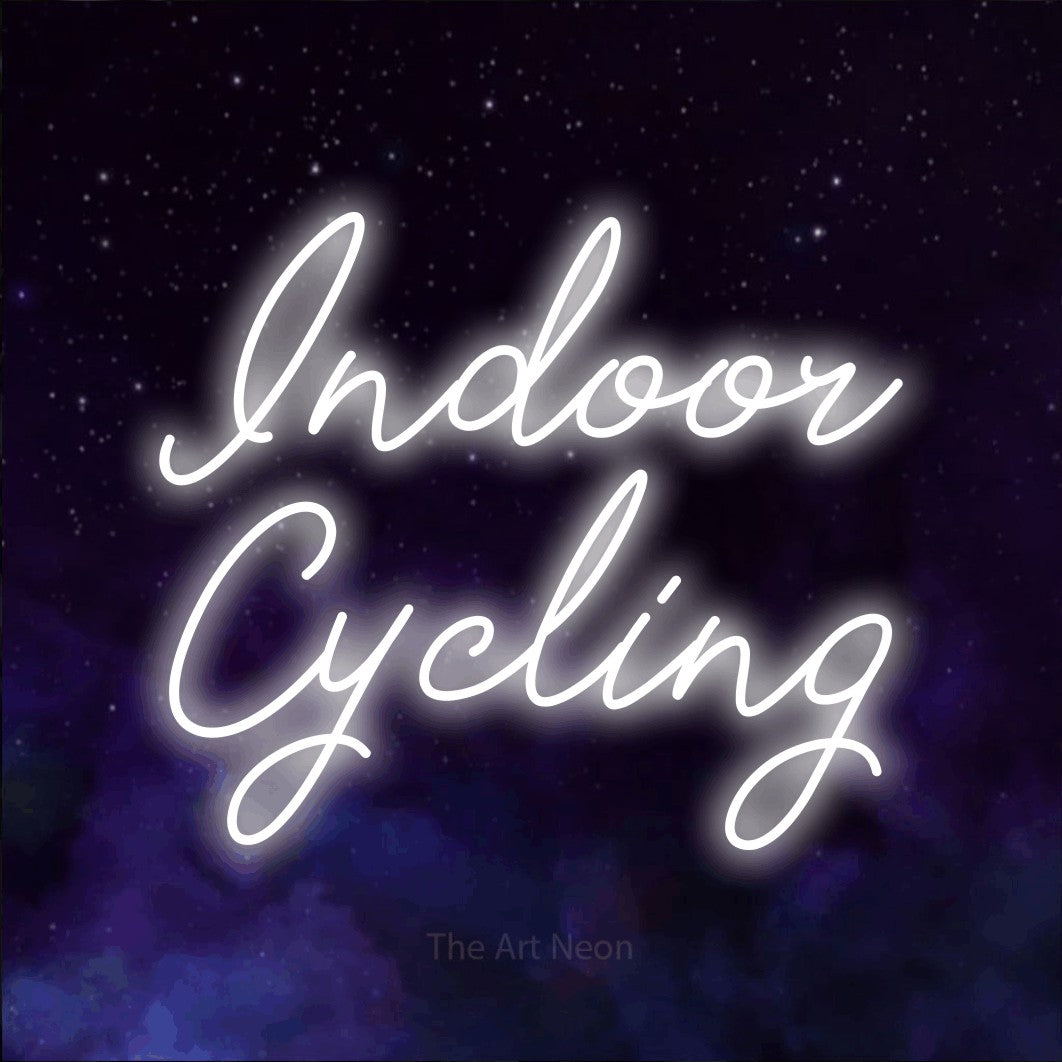 LED neon sign reading “Indoor Cycling”, arranged in 2 lines.