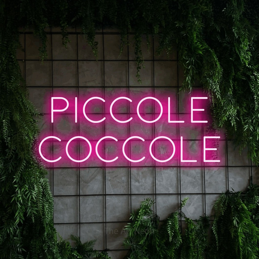 LED neon sign reading “Piccole Coccole”, arranged in 2 lines.