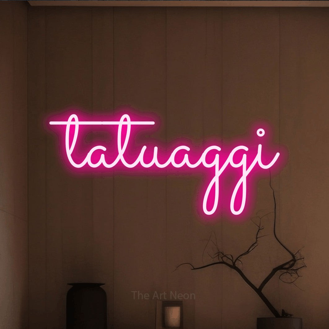 LED neon sign reading “tatuaggi”, arranged in a single line.