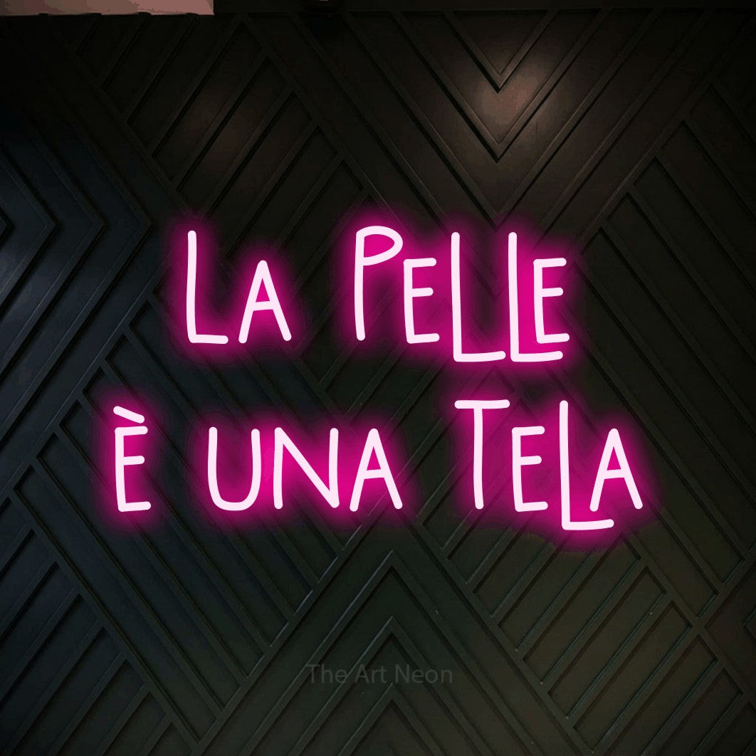 LED neon sign reading “La Pelle è una Tela”, arranged in 2 lines.