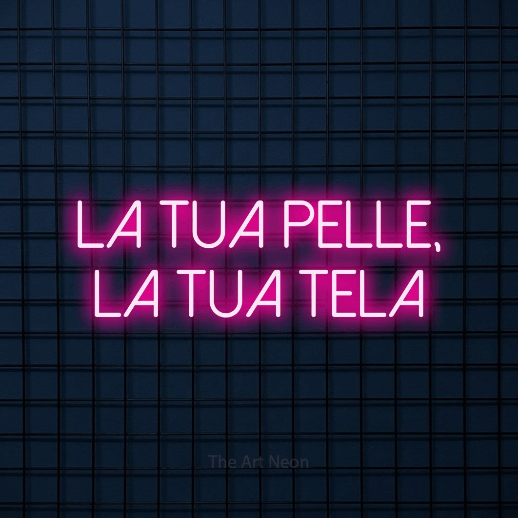 LED neon sign reading “la tua pelle, la tua tela”, arranged in 2 lines.