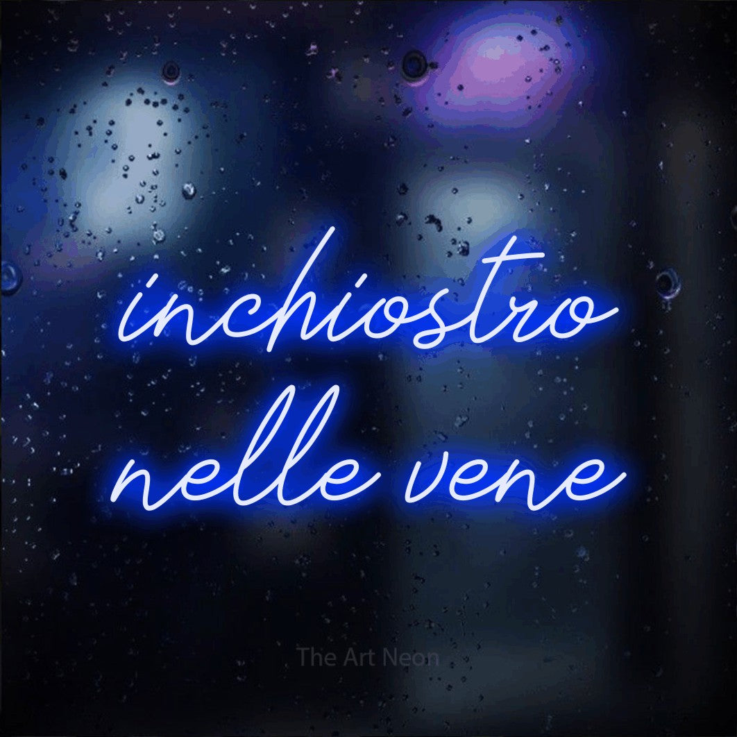 LED neon sign reading “inchiostro nelle vene”, arranged in 2 lines.