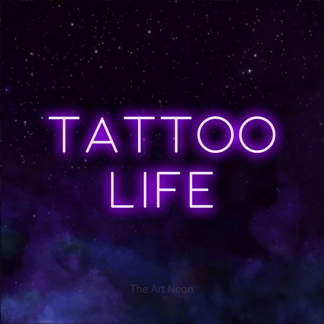 LED neon sign reading “TATTOO life”, arranged in 2 lines.
