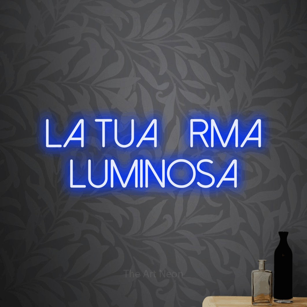 LED neon sign reading “la tua firma luminosa”, arranged in 2 lines.