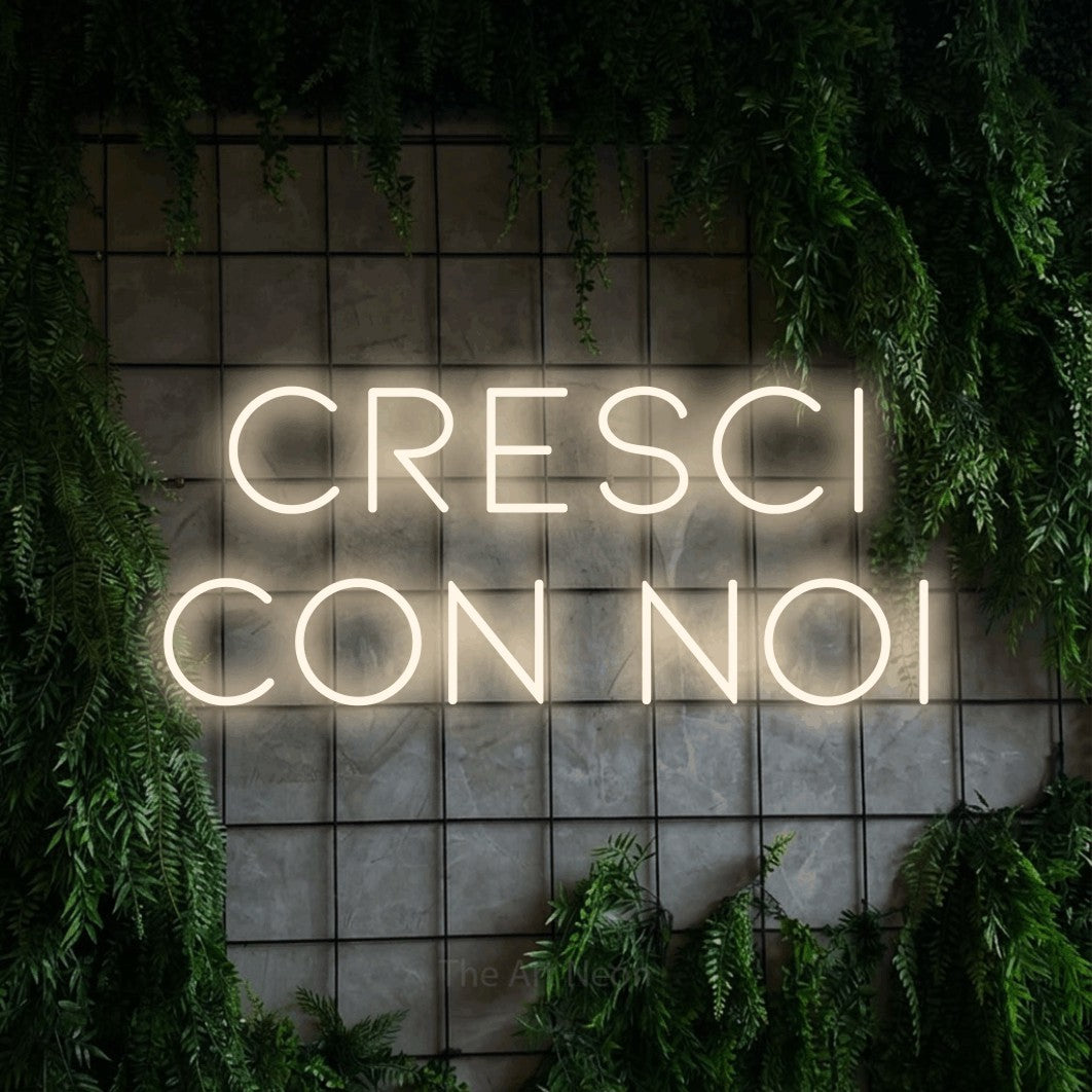 LED neon sign reading “Cresci con Noi”, arranged in 2 lines.