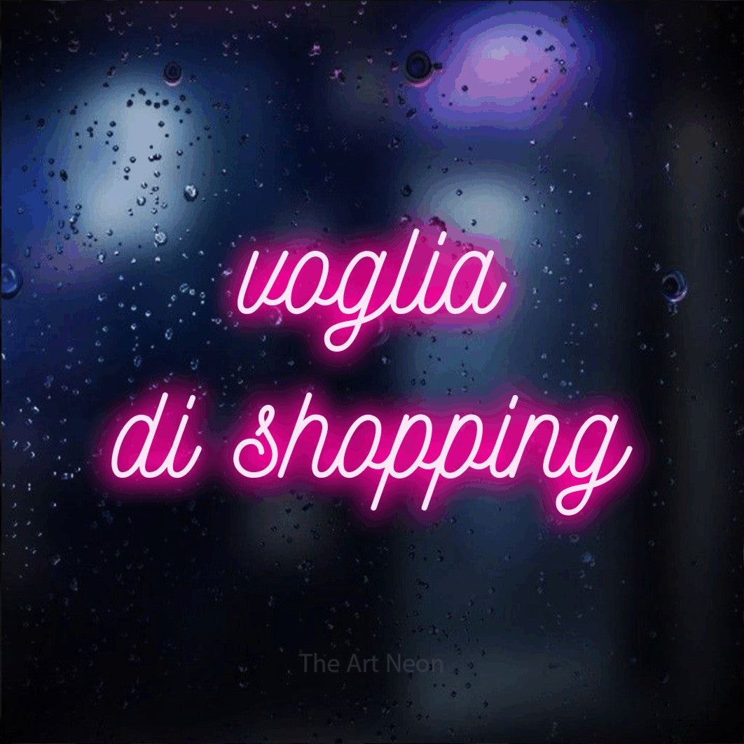 LED neon sign reading “voglia di shopping”, arranged in 2 lines.