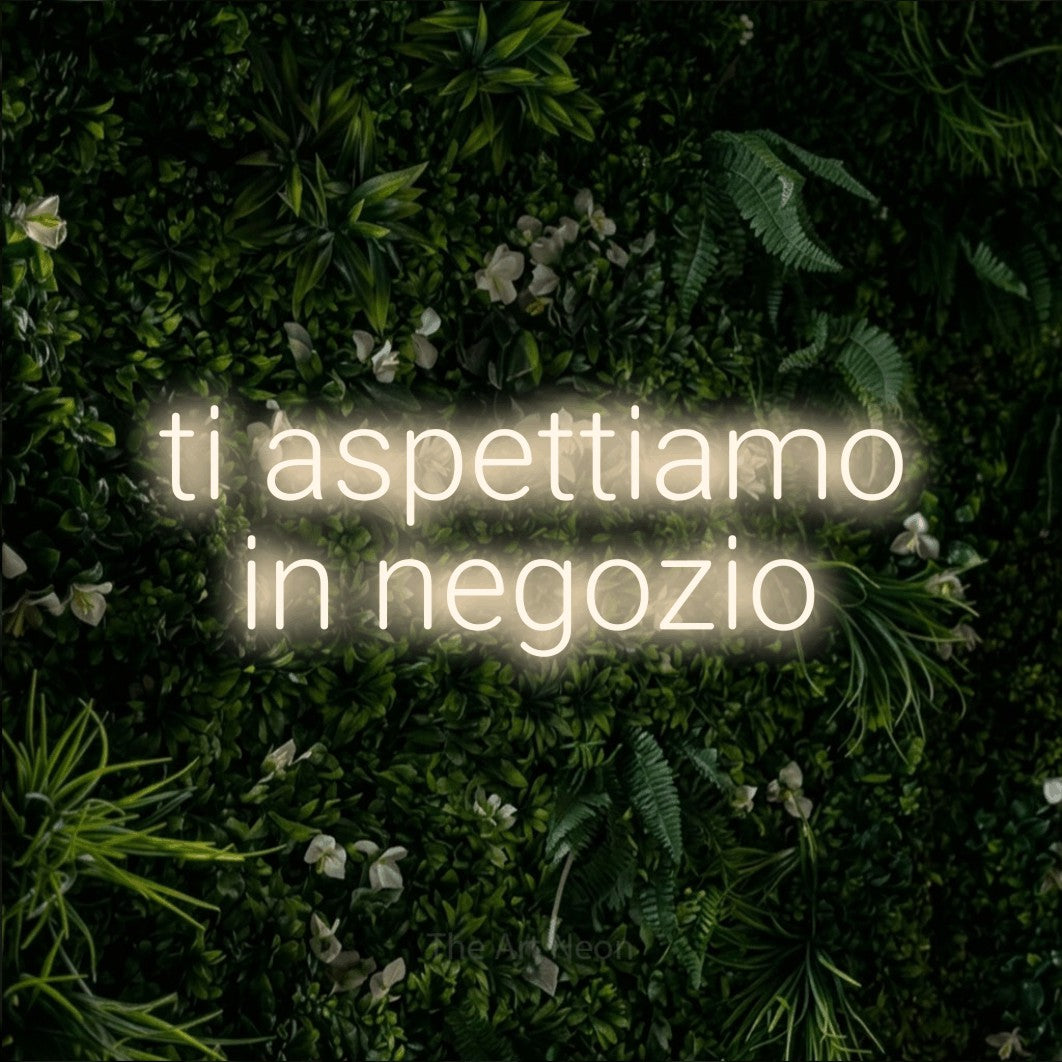 LED neon sign reading “ti aspettiamo in negozio”, arranged in 2 lines.
