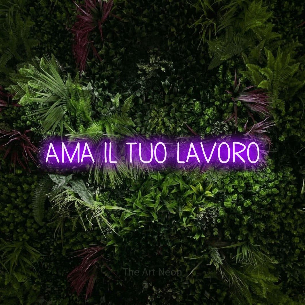 LED neon sign reading “AMA IL TUO LAVORO”, arranged in a single line.