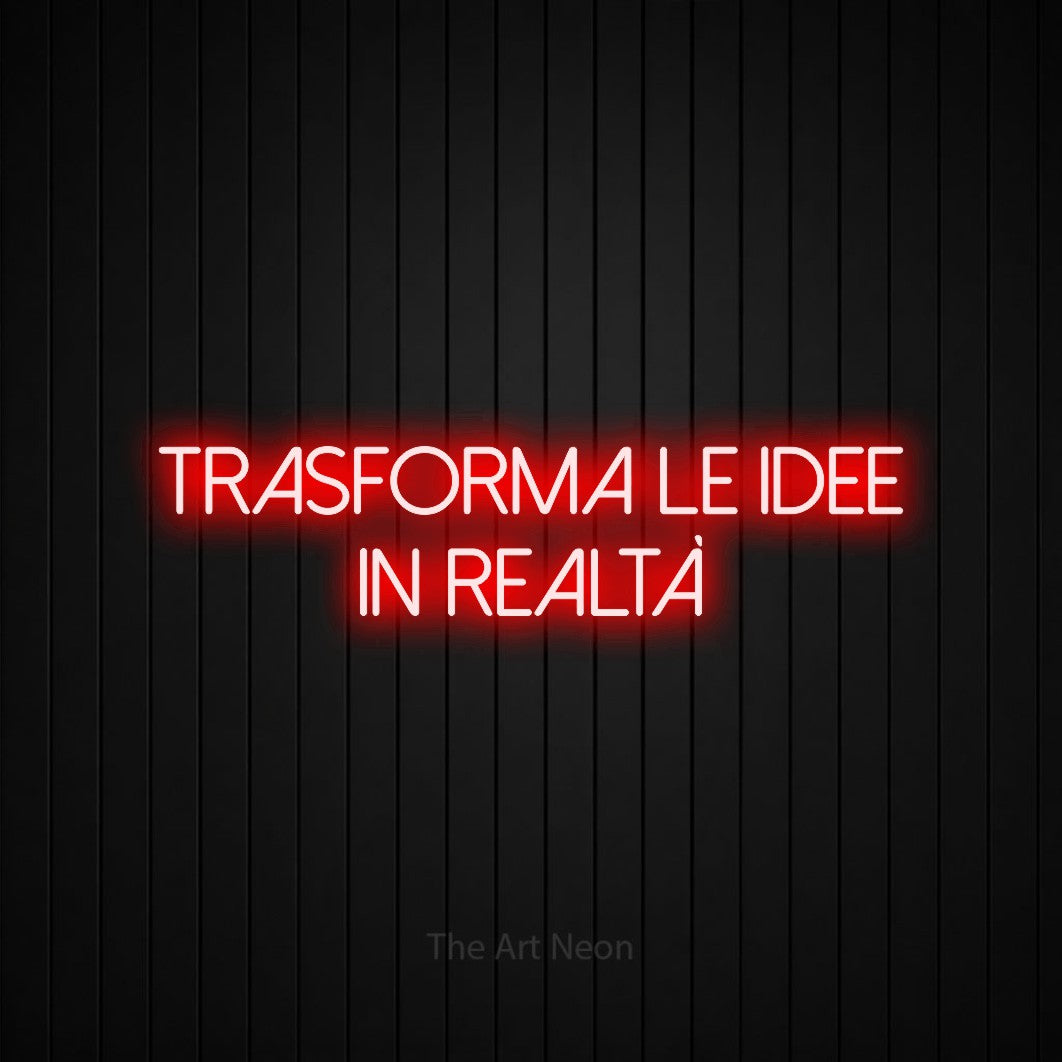 LED neon sign reading “TRASFORMA le idee in realtà”, arranged in 2 lines.