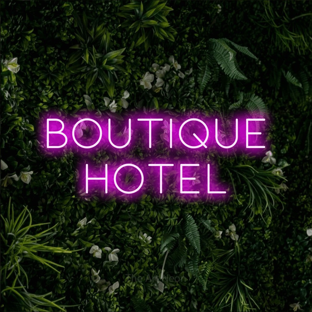 LED neon sign reading “BOUTIQUE HOTEL”, arranged in 2 lines.