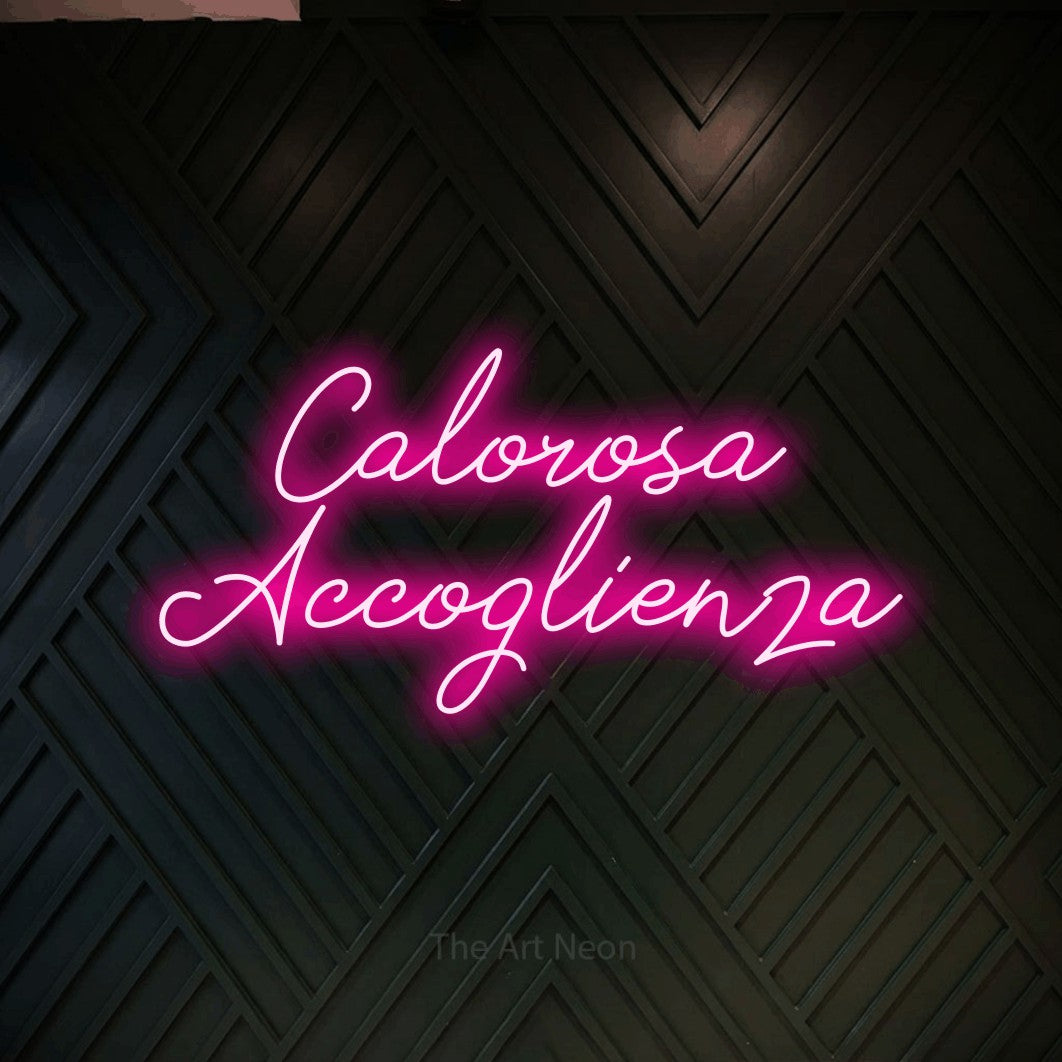 LED neon sign reading “Calorosa Accoglienza”, arranged in 2 lines.