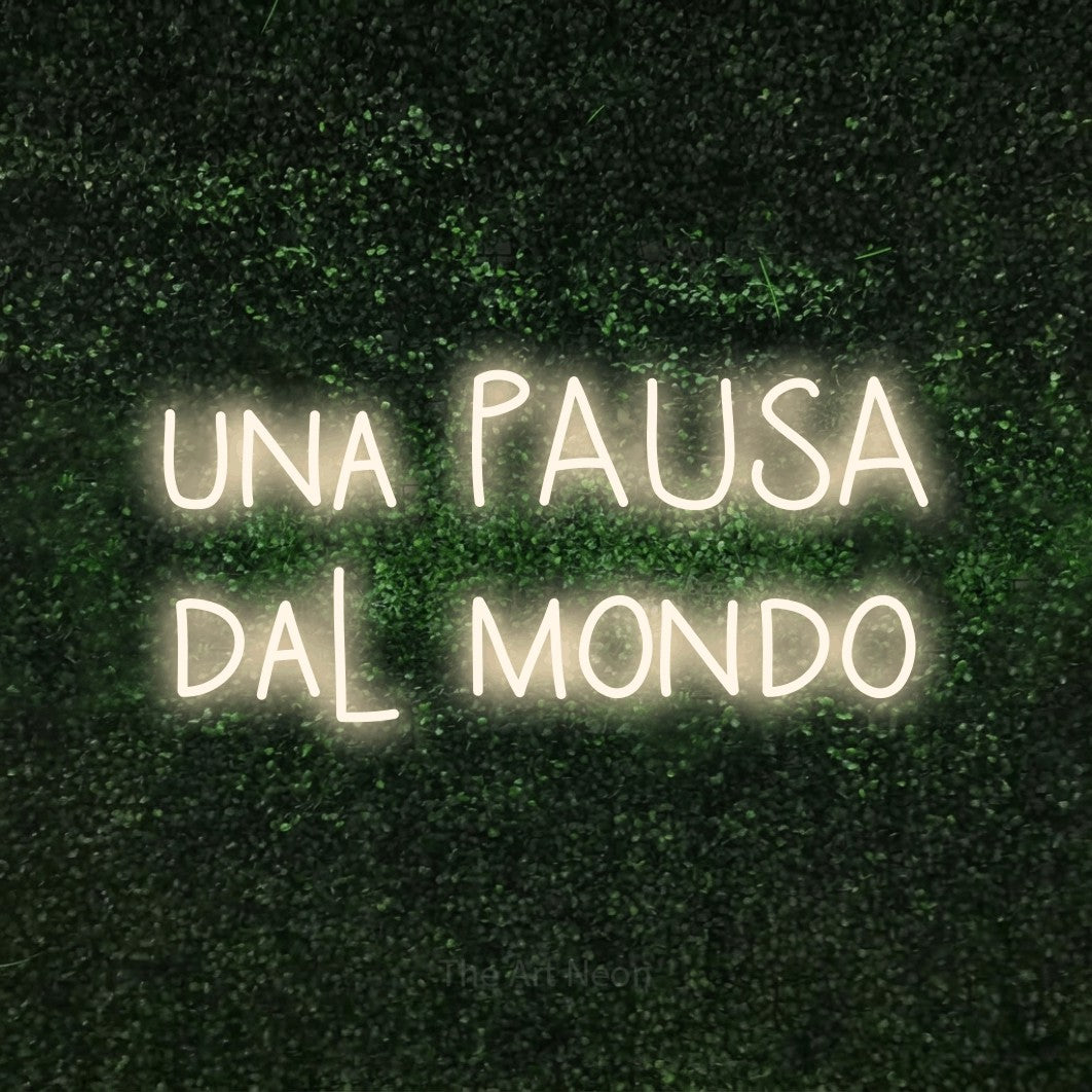 LED neon sign reading “una PAUSA dal mondo”, arranged in 2 lines.