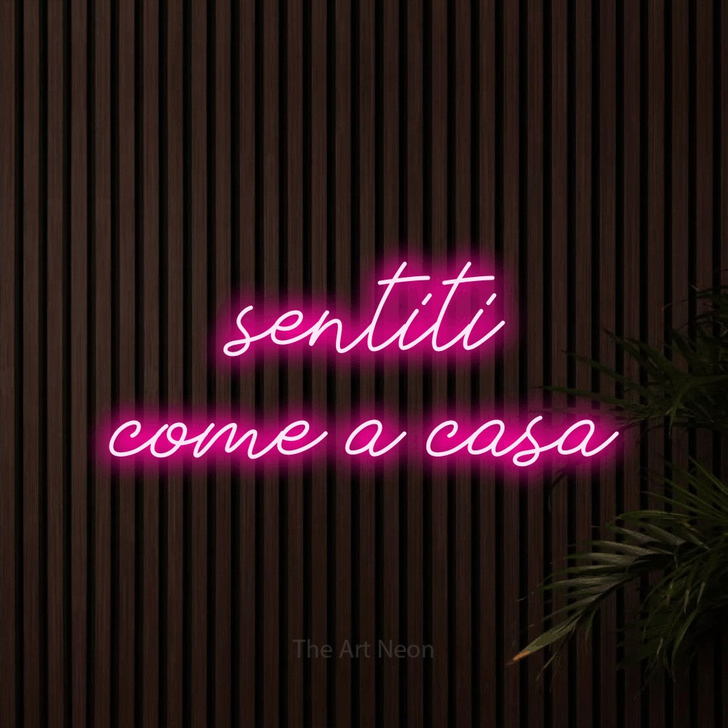 LED neon sign reading “sentiti come a casa”, arranged in 2 lines.