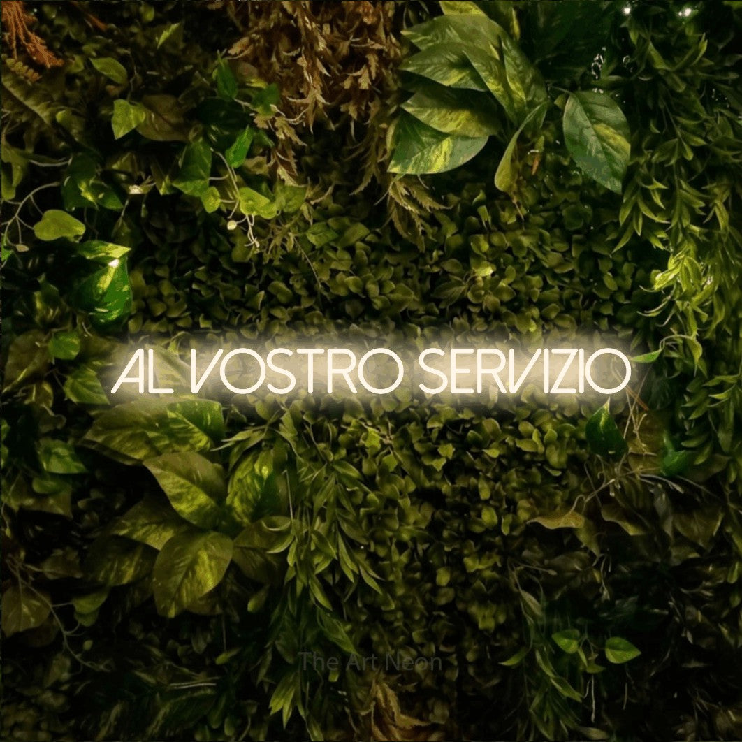 LED neon sign reading “al vostro servizio”, arranged in a single line.