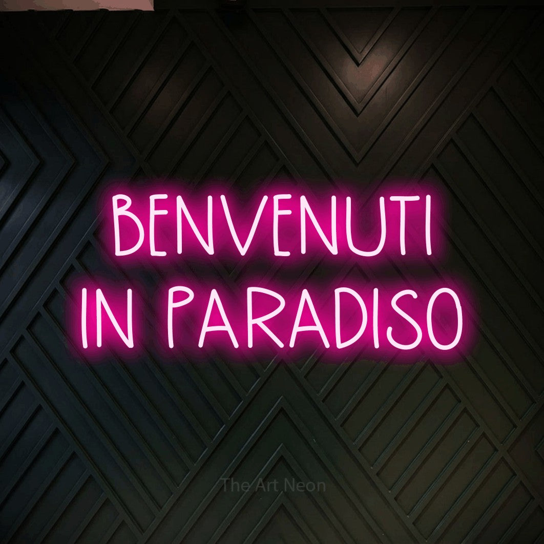 LED neon sign reading “BENVENUTI IN PARADISO”, arranged in 2 lines.