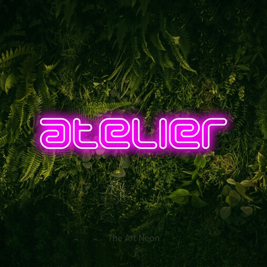 LED neon sign reading “atelier”, arranged in a single line.