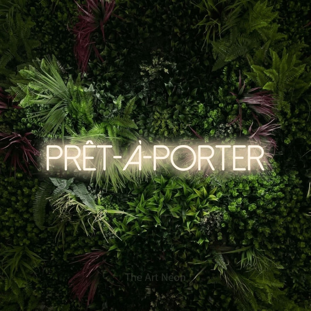LED neon sign reading “Prêt-à-porter”, arranged in a single line.