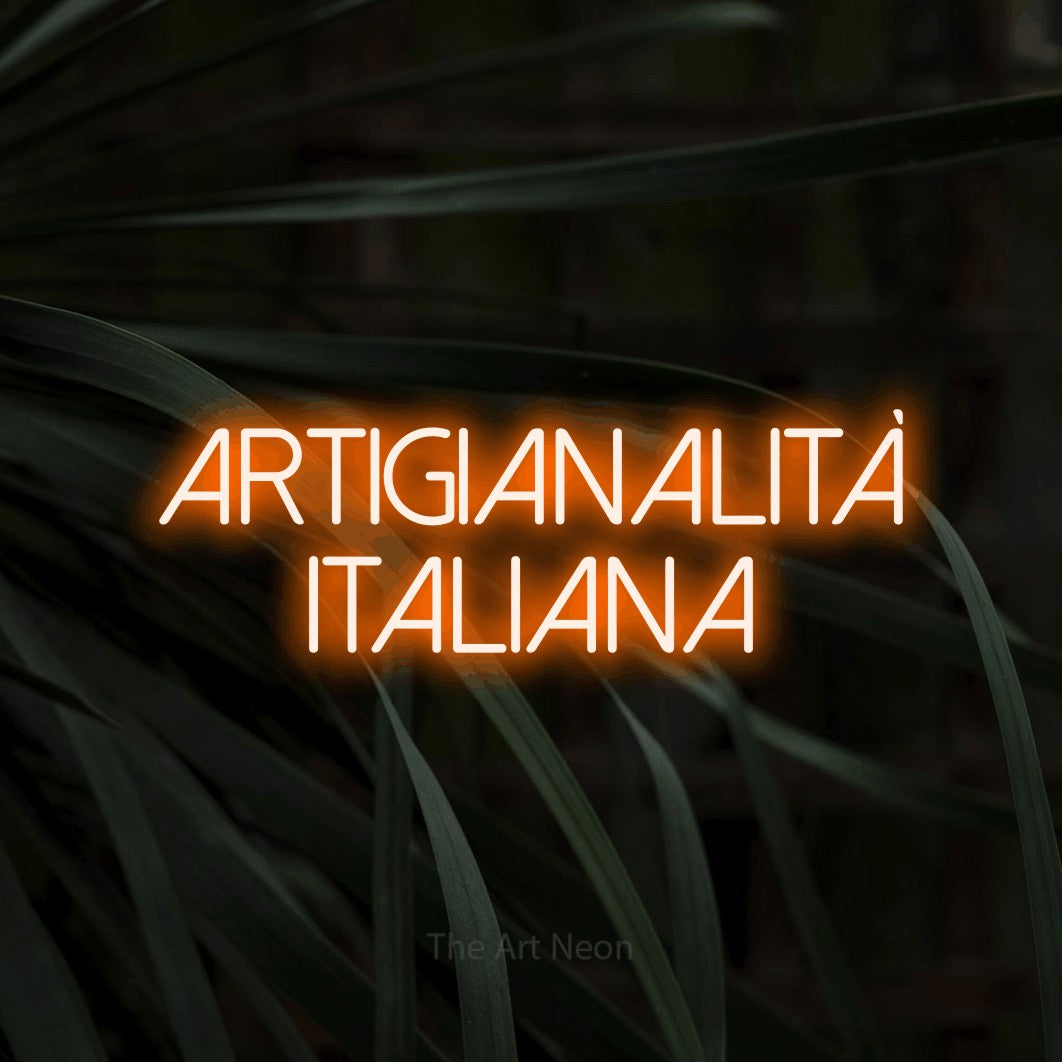 LED neon sign reading “artigianalità italiana”, arranged in 2 lines.