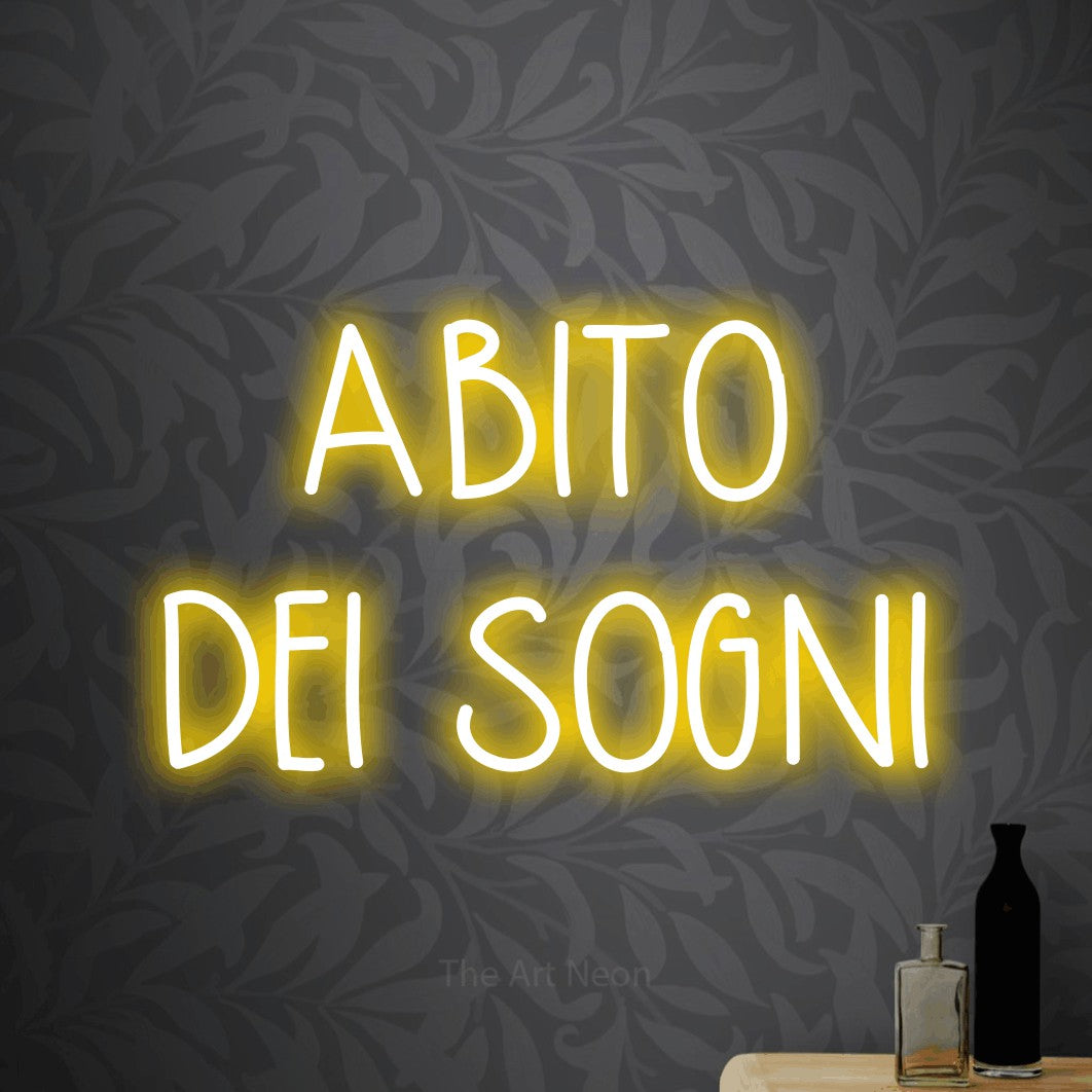 LED neon sign reading “ABITO DEI SOGNI”, arranged in 2 lines.