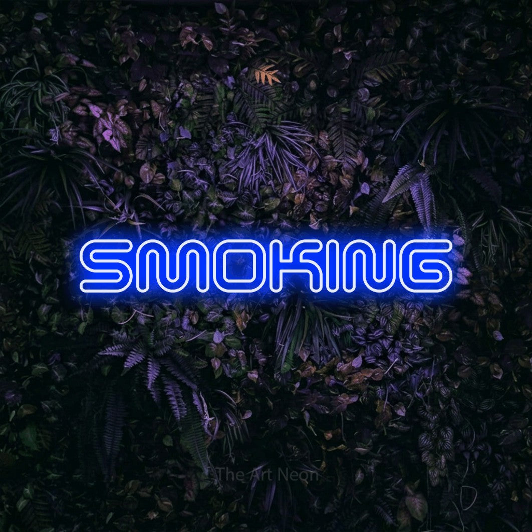 LED neon sign reading “SMOKING”, arranged in a single line.