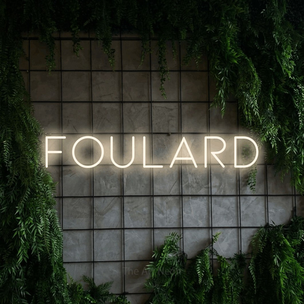 LED neon sign reading “foulard”, arranged in a single line.