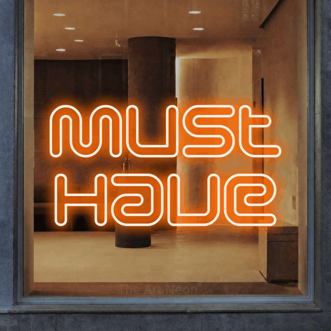 LED neon sign reading “Must Have”, arranged in 2 lines.