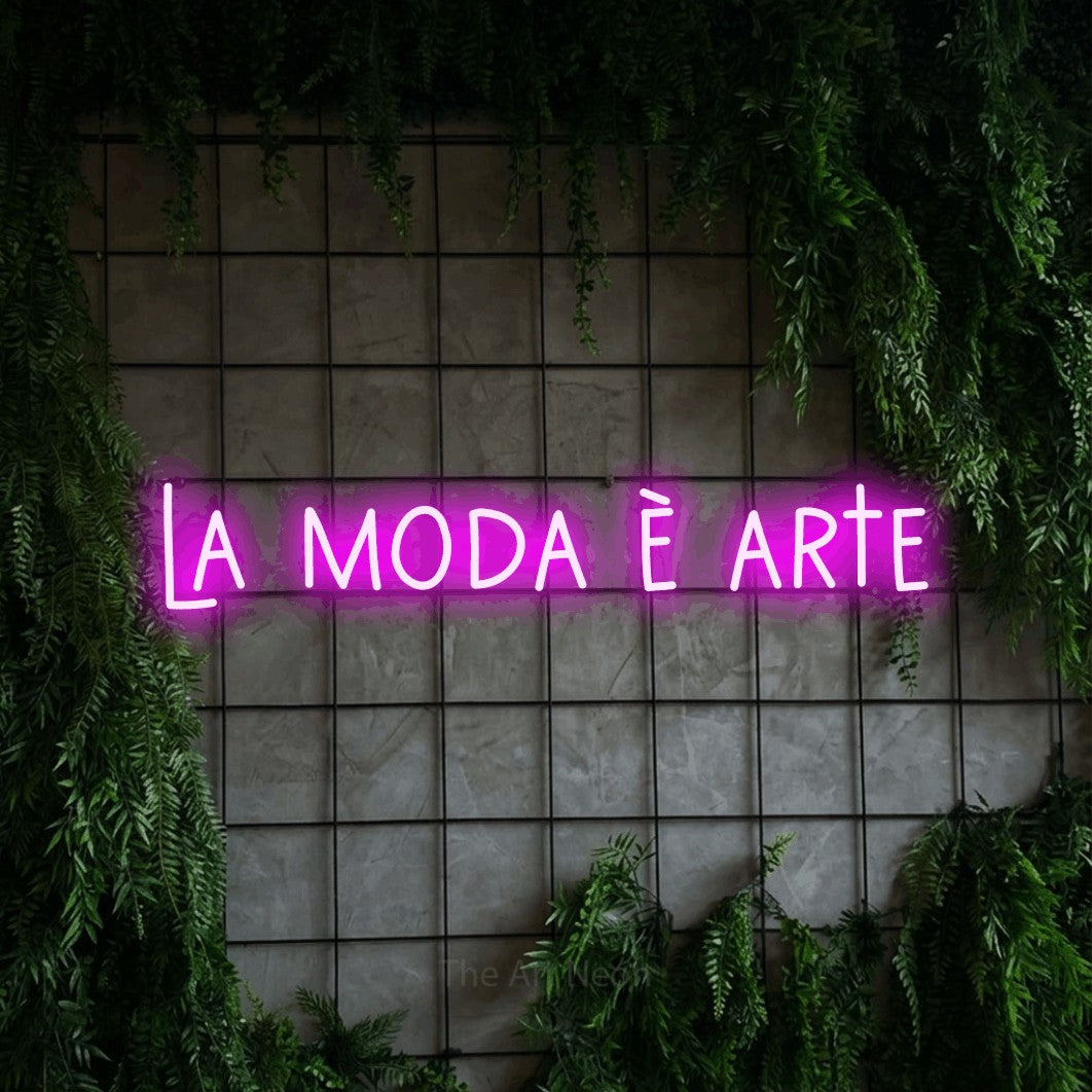 LED neon sign reading “la moda è arte”, arranged in a single line.