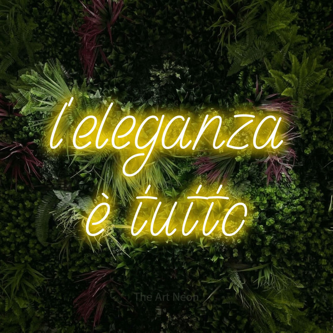 LED neon sign reading “l'eleganza è tutto”, arranged in 2 lines.