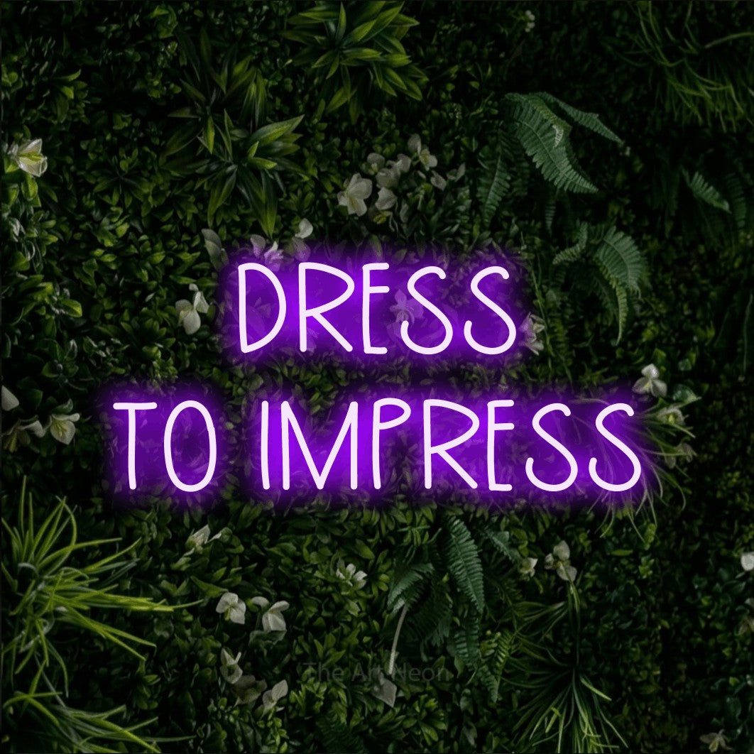 LED neon sign reading “DRESS TO IMPRESS”, arranged in 2 lines.